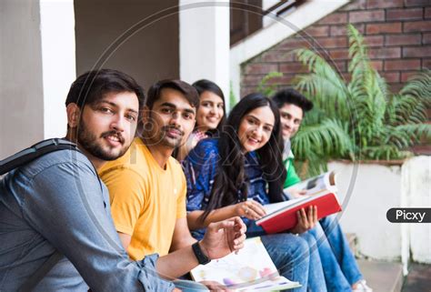 Image Of Asian Indian College Students Doing Group Study Or Working On