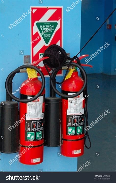 From aircraft safety to household, fire can damage so keep fire extinguisher with you to deal with any fire. Fire Extinguishers In Aircraft Hangar Stock Photo 6774676 ...