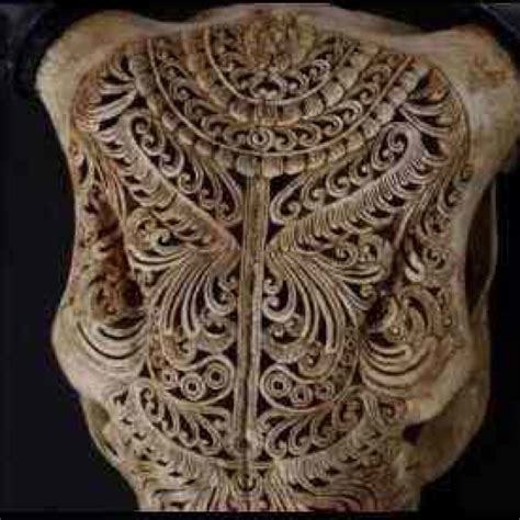 An Intricately Carved Piece Of Wood In The Shape Of A Head And Neck