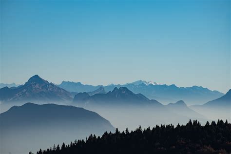 Rocky Mountains In Fog And Blue Sky Desktop Wallpaper
