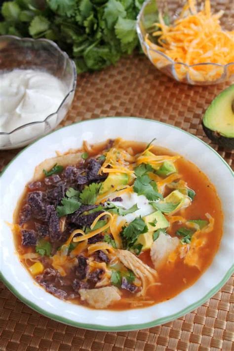 Stir salsa, soup, chicken, corn, beans, water and cumin in a slow cooker. Slow Cooker Creamy Chicken Tortilla Soup | The Spiffy Cookie