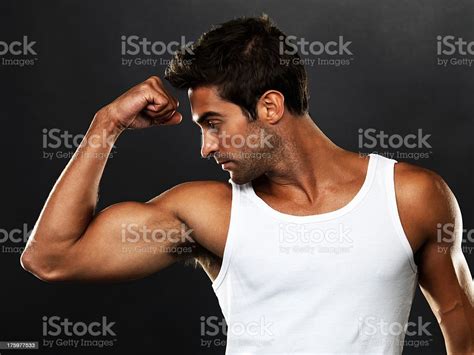 Handsome Muscular Man Flexing His Biceps Stock Image Everypixel