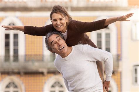 Joyful Senior Couple Having Fun Posing Husband Carrying Wife Outdoors Stock Image Image Of