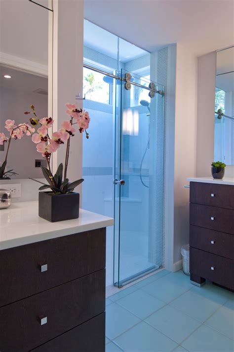 It doesn't hurt that he's got an eye for style, too! Sliding Glass Shower Door in Contemporary Bathroom | HGTV