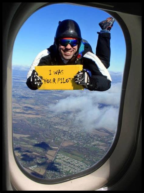 A Man Holding Up A Sign That Says I Was Your Pilot