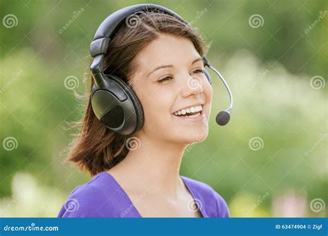 Portrait Of Young Woman Wearing Headphones Stock Photo Image Of Hear