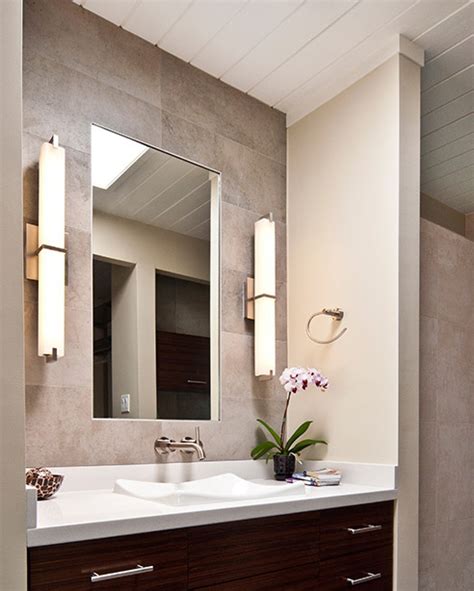 In bathrooms, mount sconces 36 to 40 inches apart, flanking the mirror, 18 inches from the sink's center line. Metro Bath Details | Tech Lighting