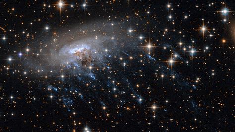 Haunting New Hubble Image Shows A Galaxy Being Ripped To Shreds