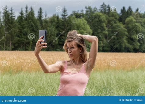Young Woman Making Funny Face As She Takes A Selfie Stock Image Image