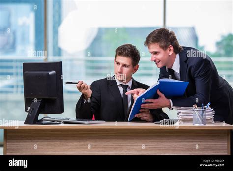 Two Twin Brothers Discussing Business Project Stock Photo Alamy