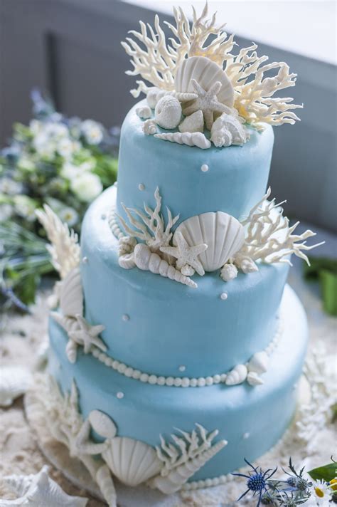 White Seashell And Coral Decorated Blue Wedding Cake Beach Wedding