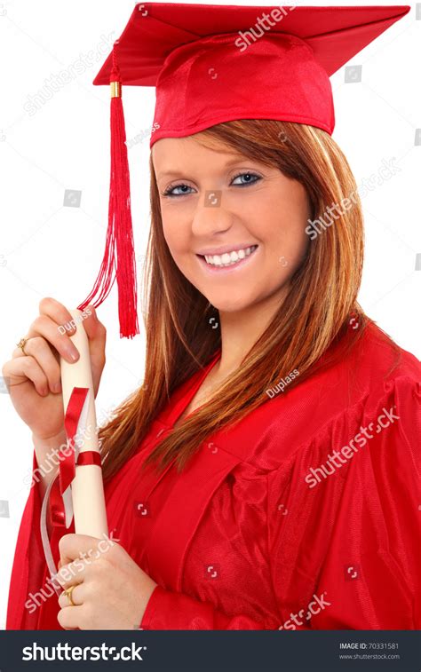 Beautiful Red Head Young Woman In Red Graduation Cap And Gown With