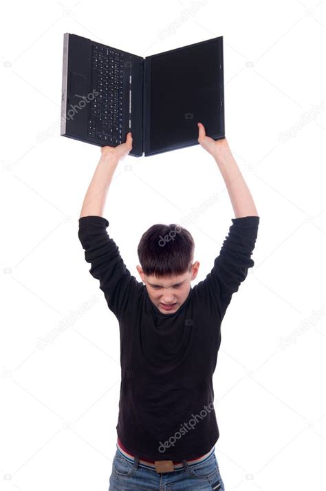 Angry Teenage Boy Throwing Laptop Isolated On White