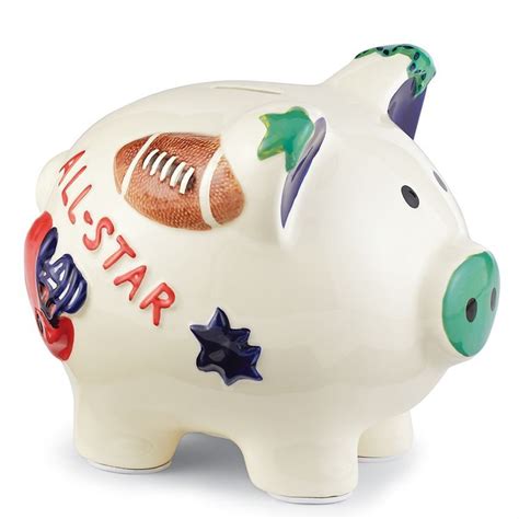 The all star sports piggy bank from mud pie is adorned with hand painted baseball and football icons with stars, blue ears and a green nose. Mud Pie All Boy Sports Bank | Baby boy, Baby piggy banks