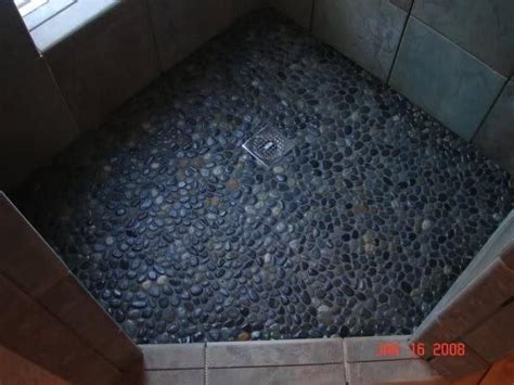 Black shower floor tile are used to beautify residential and commercial spaces, be it the kitchen backdrop or the exterior walls of the building. Pebble Shower Floor with Dark River Rock with Dark Grout ...