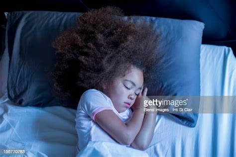 dark hair girl in bed sleeping photos and premium high res pictures getty images