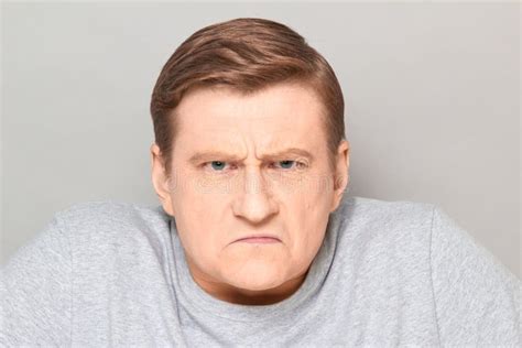 Portrait Of Angry Disgruntled Mature Man With Frowning Face Stock Image