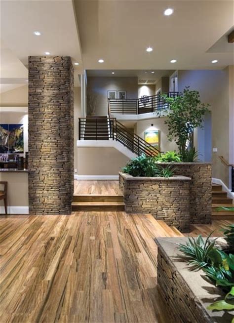 Stone tile flooring adds natural beauty and timeless elegance to any room. Welcome to my dream...wood floor, stone column and ...