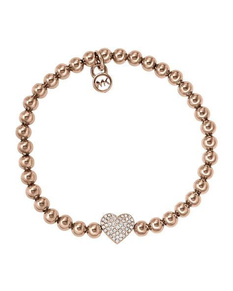 A Silver Beaded Bracelet With A Heart Charm On The Clasp And An K
