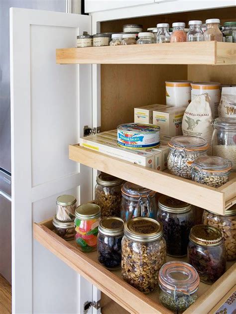 An Organized Pantry With Jars And Spices