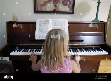 Child Playing A Piano Stock Photo Alamy