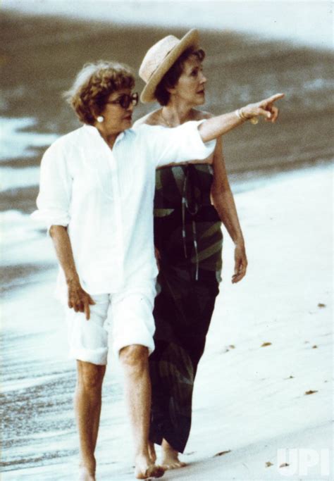 Photo Nancy Reagan And Actress Claudette Colbert Stroll Along Beach In Barbados