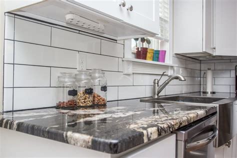 In one of your conversation threads, it was mentioned to go with the white subway tiles, i have seen this look and think that the tile looks cheap in comparison to the granite. titanium granite countertops with white cabinets - Google ...