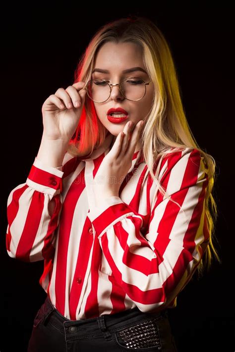 Glorious Blonde Lady Wearing Glasses Dressed In Trendy Blouse Stock