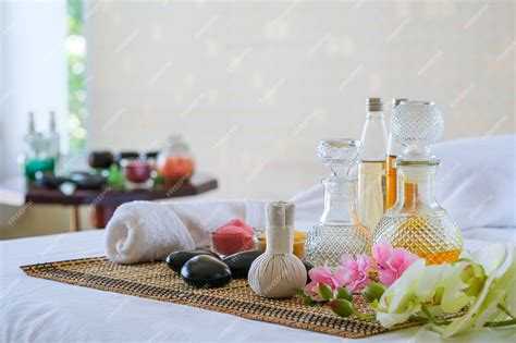 Premium Photo Spa Treatment Set And Aromatic Massage Oil On Bed Massage Thai Setting For