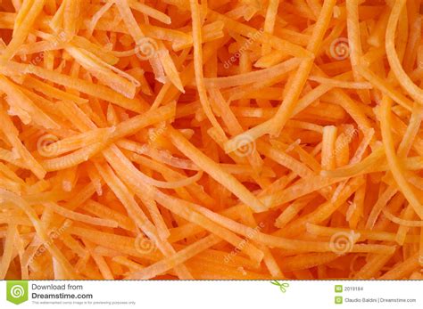 Slice lengthwise one side of the carrot. Carrots (julienne) Texture Background Stock Images - Image: 2019184