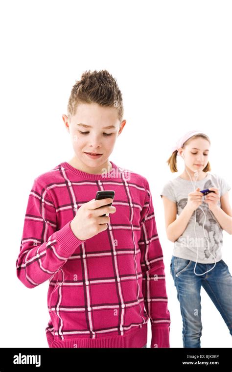 Boy With A Mobile Phone And A Girl With An Ipod Stock Photo Alamy