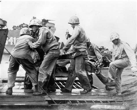 Wounded Marine Gets Transfusion Loaded On Lst World War Photos