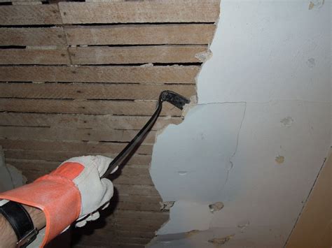 Press the edge of the knife into the edge of the wall and cut along the entire length of it. Removing plaster from the wall/ceiling--not necessary to ...