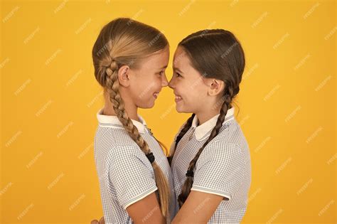 Premium Photo Friendly Hug Cute Schoolgirls Girls Braided Hairstyle