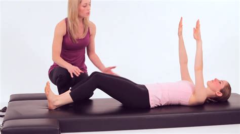 How To Do A Roll Up In Pilates Howcast Pilates For Beginners