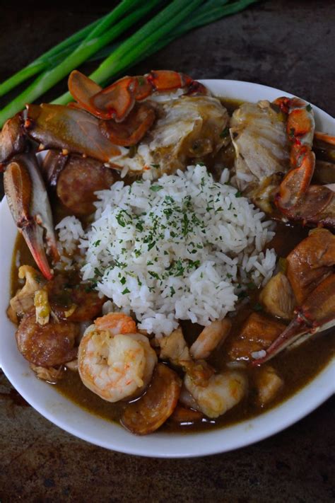 Stir diced tomatoes with juice, shredded chicken, chicken broth, vegetable juice cocktail, browned flour, and creole seasoning into sausage mixture. Seafood Gumbo - Coop Can Cook