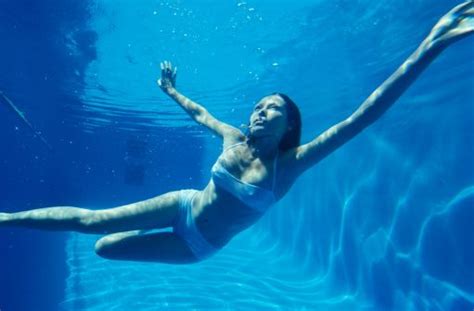 Woman Swimming Underwater In A Pool Swimming Photography Underwater