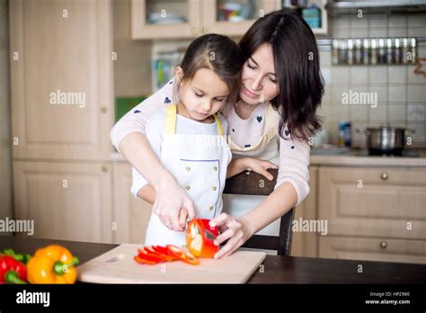 Mother And Daughter Cooking Stock Photo Alamy