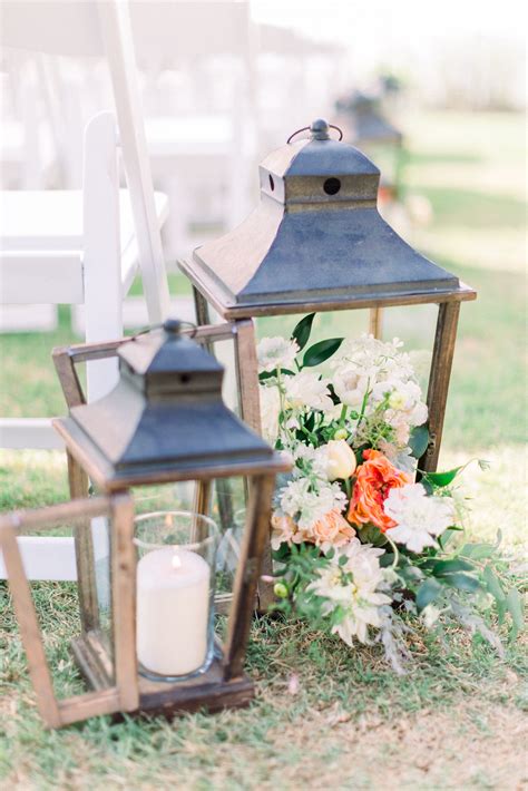 Aisle Decorations With Lanterns Candles And Flowers