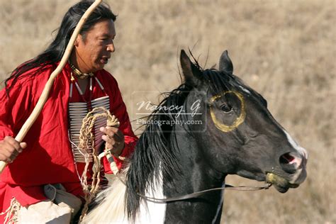 A Native American Sioux Indian Man Riding Horseback On A Indian Horse