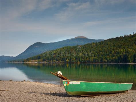 Abandoned Fishing Paddle Boat On Bank Of Alps Lake Morning Lake