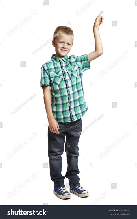 8 Year Old School Boy Pointing Up On White Background
