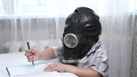 Little Short Haired Caucasian Boy Tries To Wear Gas Mask His Sister
