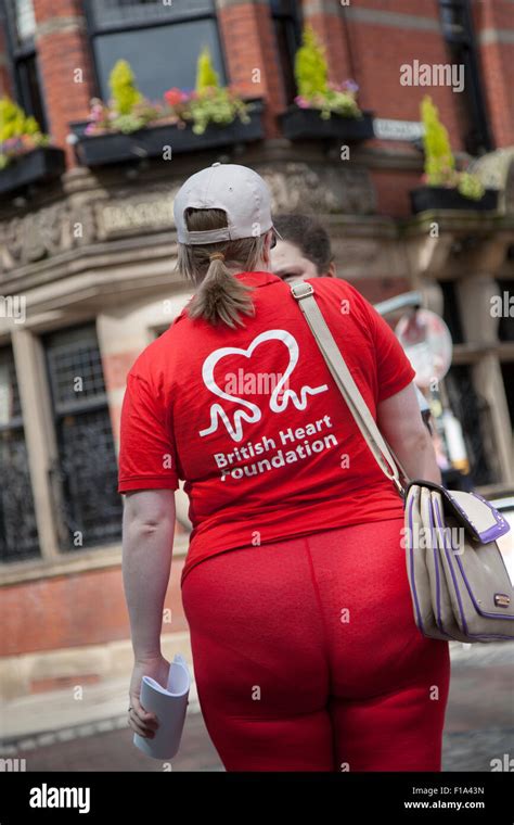 Rear View Of British Heart Foundation Charity Face To Face Female