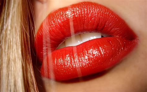 women model blonde long hair face red lipstick hair in face closeup gloss open mouth