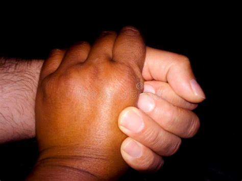 Black And White Hands Joined Together In A Friendly Handshake Stock