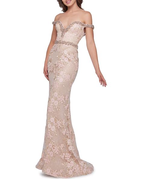 A fully embroidered floral gown featuring an illusion bodice accented by a beaded waistline. Mac Duggal Off-the-shoulder Beaded Trim Lace & Floral ...