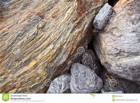 Textured Rock Background With Rust Colored Iron Ore Layers Stock Photo