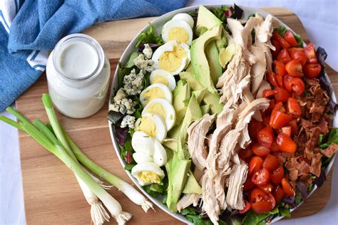 Cobb Salad With Creamy Gorgonzola Dressing With Two Spoons