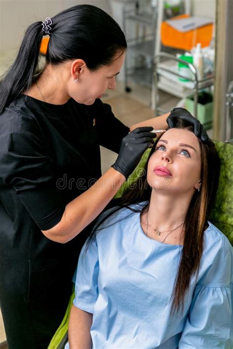 Beautician Apply Marks On The Females Face For Botulinum Toxin